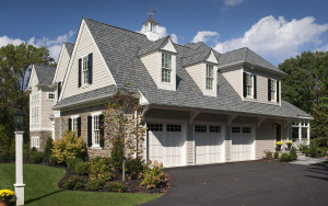 Golf club road house view of three car garage and gable roof in Newtown Square, PA