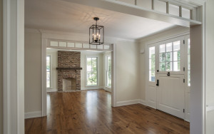 Red Fox Lane Foyer in contemporary farmhouse style interior design with cased room openings and transom windows in Wayne, PA