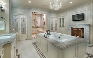 Ardrossan Estate bathroom with marble countertops, bathtub, chandelier, fireplace, shower, and two water closets in Villanova, PA