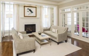Ashwood hall Living room with fireplace, glass doors, and classic window grids in Devon, PA