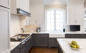 Ashwood Hall view of modern and spacious kitchen with stove and arched window in Devon, PA